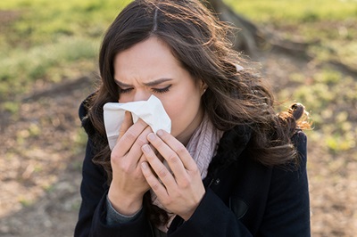 women blowing nose sinus 